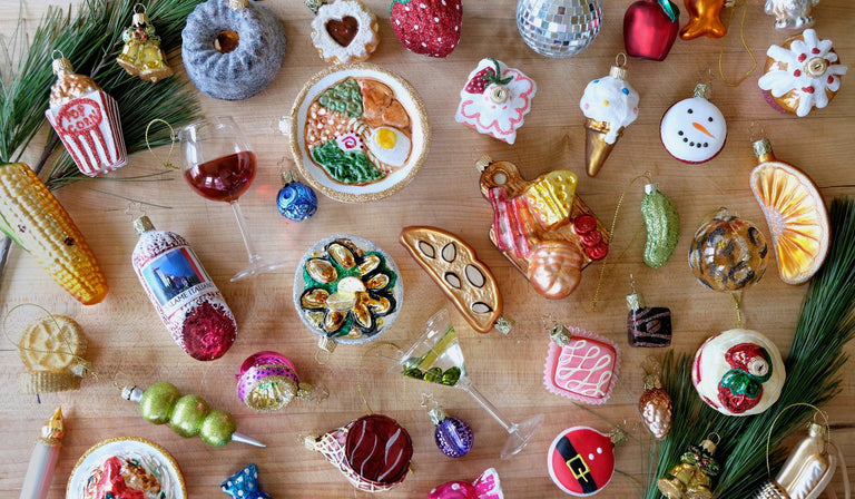 a table with ornaments and a glass of wine