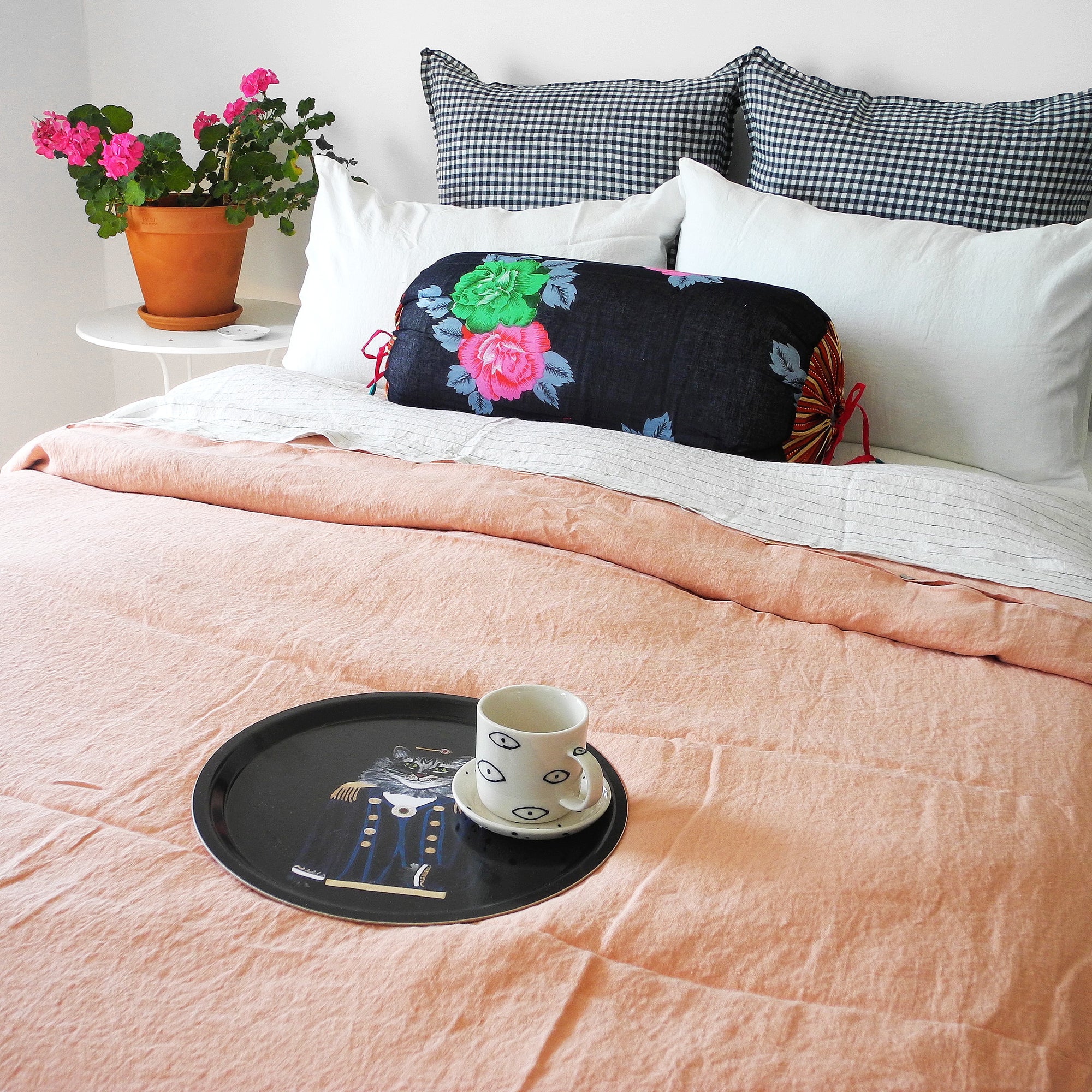 A Linge Particulier Linen Duvet in Copper gives a salmon and pink color to this duvet for a colorful linen bedding look from Collyer's Mansion