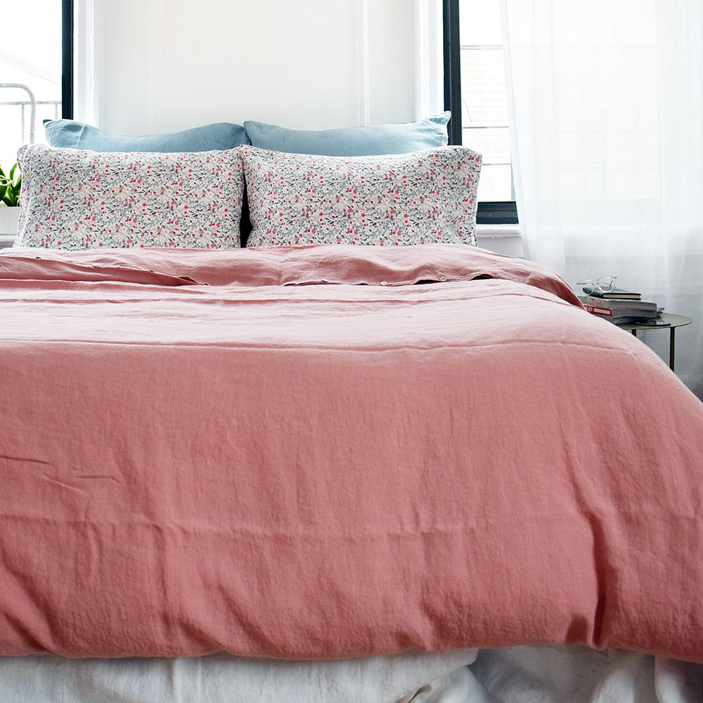 A Linge Particulier Linen Duvet in Lychee gives a deep salmon and old pink color to this duvet for a colorful linen bedding look from Collyer's Mansion