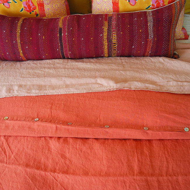 A Linge Particulier Linen Duvet in Terracotta gives a vibrant orange and sunset color to this duvet for a colorful linen bedding look from Collyer's Mansion